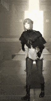 a girl is standing in a dark room with a light shining through the door .