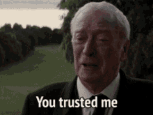 an older man in a suit and tie is crying and saying you trusted me