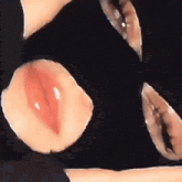 a close up of a person 's mouth with a black mask on their face .