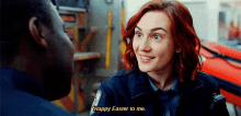 a woman in a police uniform is talking to a man and says " happy easter to me "