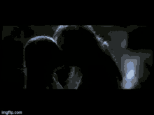 a close up of a person 's face in the dark