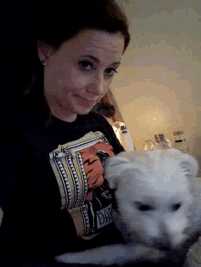 a woman wearing a black shirt that says bad