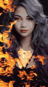 a woman with gray hair and red eyes is surrounded by flames