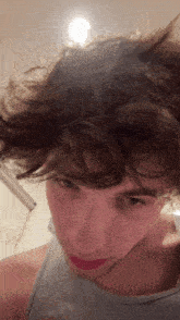 a close up of a person 's face with a lot of hair on it