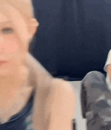 a blurry picture of a woman 's face and shoulder