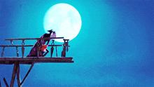 a full moon is visible behind a person on a balcony