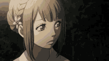 a girl with a flower in her hair looks at something