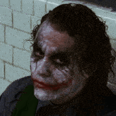 a close up of a man 's face with white paint