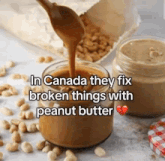 a jar of peanut butter is poured into another jar