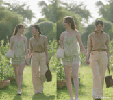 two women holding hands in a field with the words lingermoifss on the bottom right