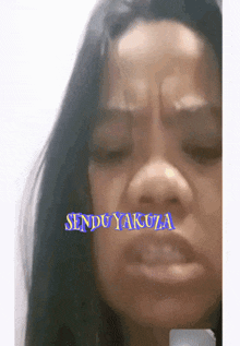 a close up of a woman 's face with the words sendo yakuza written on it