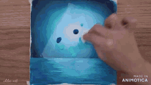 a person is painting a picture with the words made in animatica