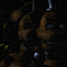 a teddy bear is holding a microphone in a dark room next to a green clown