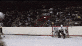 a hockey game is being played in a stadium with movieclips.com on the bottom