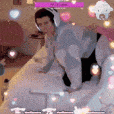 a person wearing headphones is kneeling on a bed in front of a screen that says vanillamacae