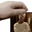 a hand is holding a picture of a man with his arms crossed in front of a picture .