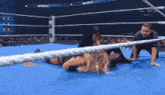 two women are wrestling in a ring with the word smack on the ring