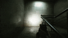 a person holding a gun in a dark hallway