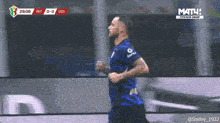 a soccer player is running on the field during a match between inter and udi