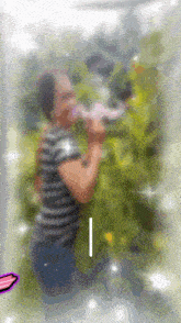 a blurry picture of a person with the letter i on the bottom right