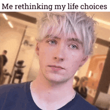 a young man with white hair and blue eyes looks at the camera with a caption that says me rethinking my life choices