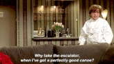 a man sitting on a couch with the words why take the escalator