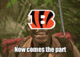 a man is smiling with a bengals logo on his face