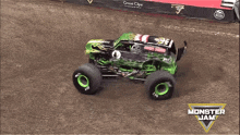 a monster jam truck is driving through the mud