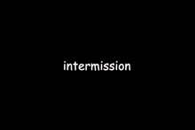 a woman is laying in a red box with the word intermission on the bottom