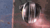 a close up of a metal object that looks like a helmet