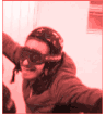a man wearing a helmet and goggles is taking a picture of himself .