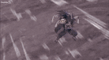 a person is flying through the air with a blue light coming out of their hand .