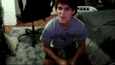 a young man wearing a purple shirt that says ' parks lunch ' on it