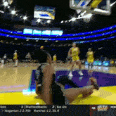 a basketball game is being played on a television screen