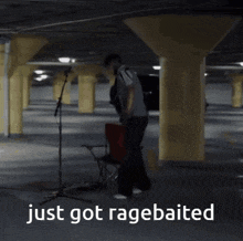 a man playing drums in a parking garage with the words just got ragebaited below him