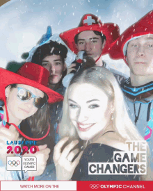a group of people posing for a photo with the words the game changers on the bottom right