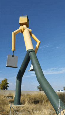 a large statue of a man carrying a briefcase and a box