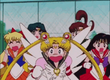 a group of sailor moon characters are standing around each other with their mouths open