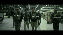 a group of soldiers are walking in a warehouse and one of them is named sold- 1 rocha
