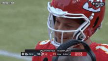 a football player wearing a helmet with a cbs logo on it