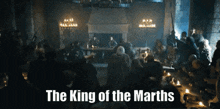 a group of people are gathered in a room with the words " the king of the marthas " on the bottom right