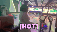 a woman at a bowling alley with the words hot written on the bottom