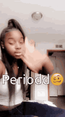 a girl is making a funny face with the word periodd written on her face