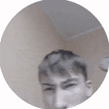 a man in a circle with a clock in the background