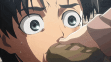 a close up of a person 's face with a surprised look on his face