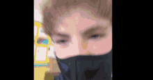 a close up of a person wearing a face mask