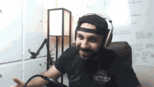 a man wearing headphones and a shirt that says guild wars 2