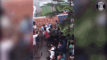 a group of people are gathered in front of a wall that says trabajo