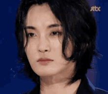 a close up of a person 's face with jtbc written on the bottom right