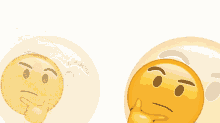 a smiley face with a finger on its chin